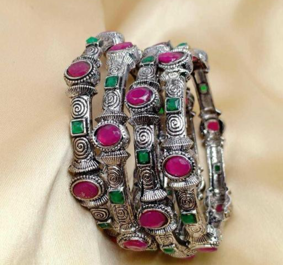 Oxidized bangles set with pink and green stones