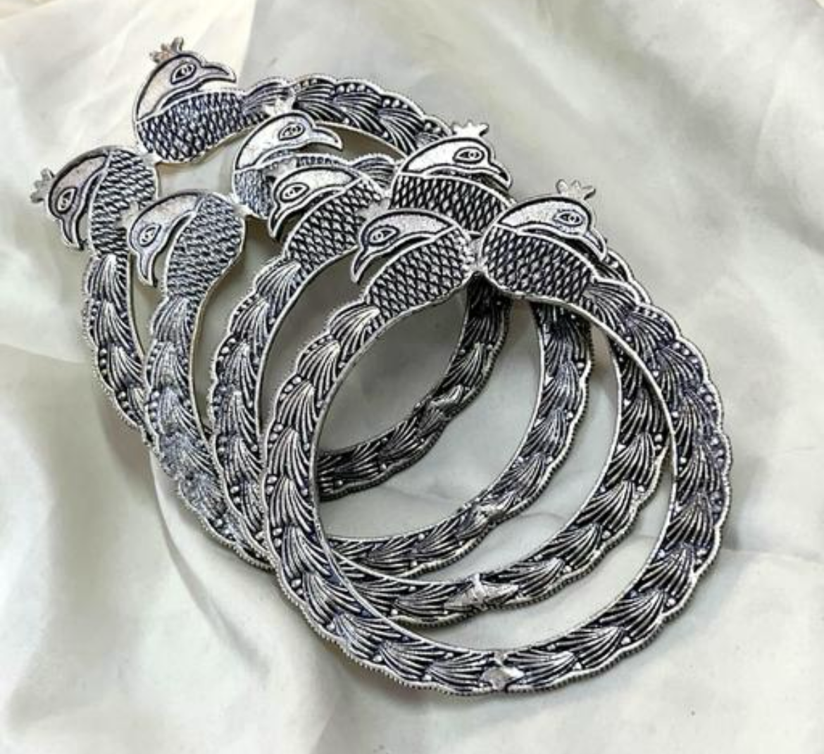 Traditional oxidized silver peacock accented bangles set