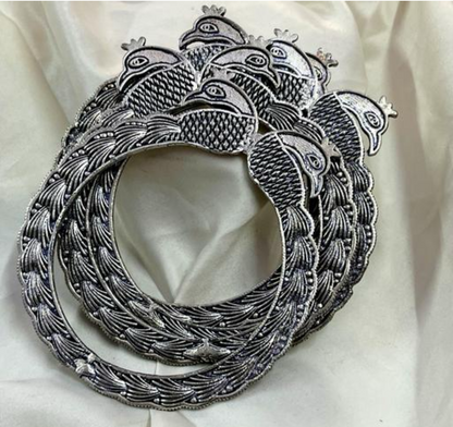 Traditional oxidized silver peacock accented bangles set